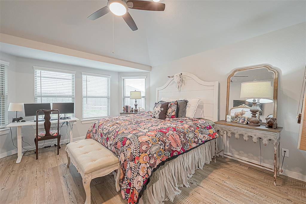 Secondary view of primary bedroom and bay window.