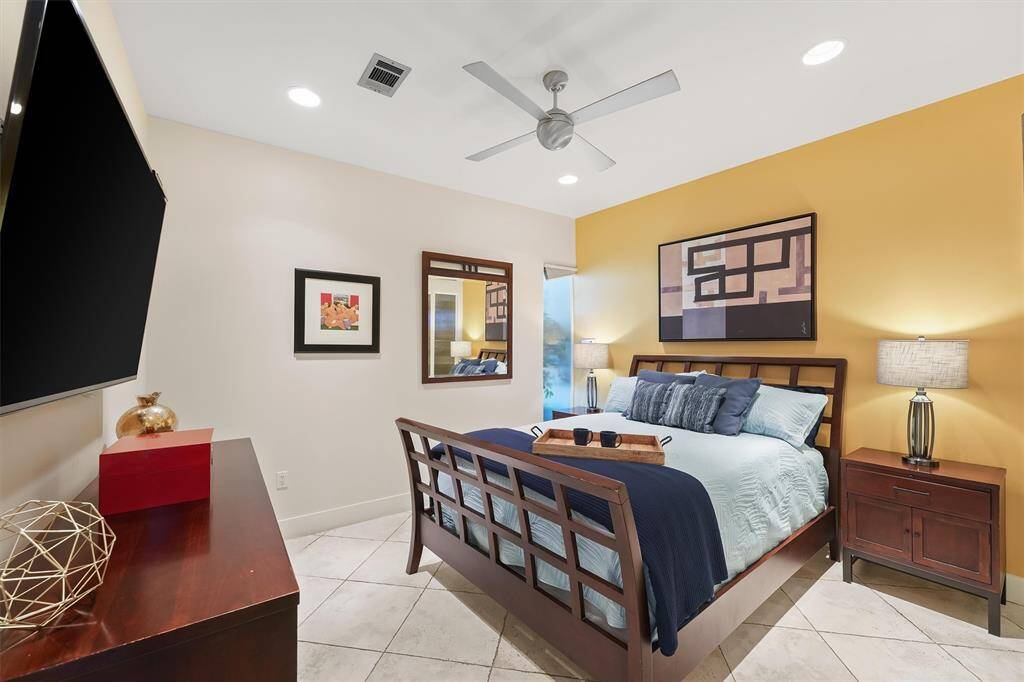 Fully furnished primary suite with plush bedding.