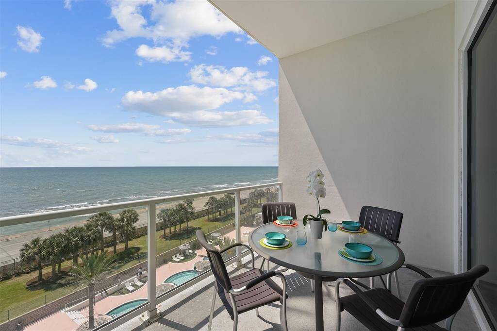 Spacious private balcony with panoramic Gulf views—perfect for morning coffee, watching pelicans fly by, or enjoying the coastal breeze.