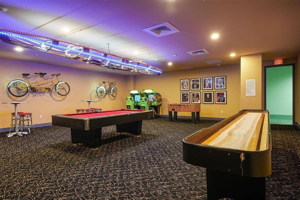 The game room offers pool tables, foosball, and more, while the jungle-themed playroom provides fun for younger residents.