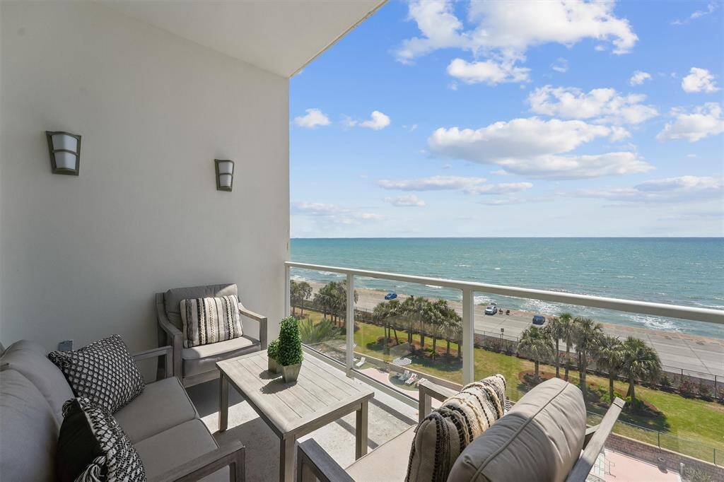 Spacious private balcony with panoramic Gulf views—perfect for morning coffee, watching pelicans fly by, or enjoying the coastal breeze.