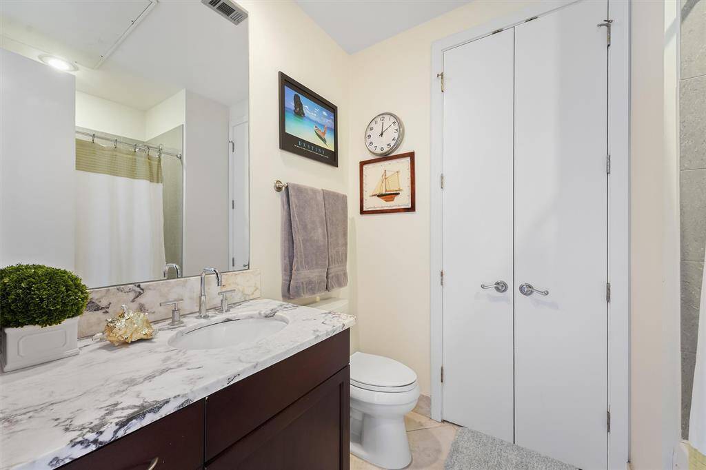 Well-appointed second bathroom with modern fixtures, full tub/shower combo, and high-end finishes