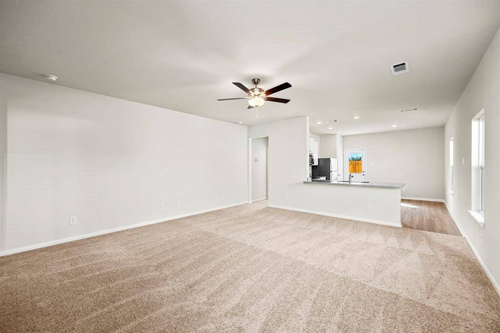 The living room has an open concept and plenty of space to entertain.