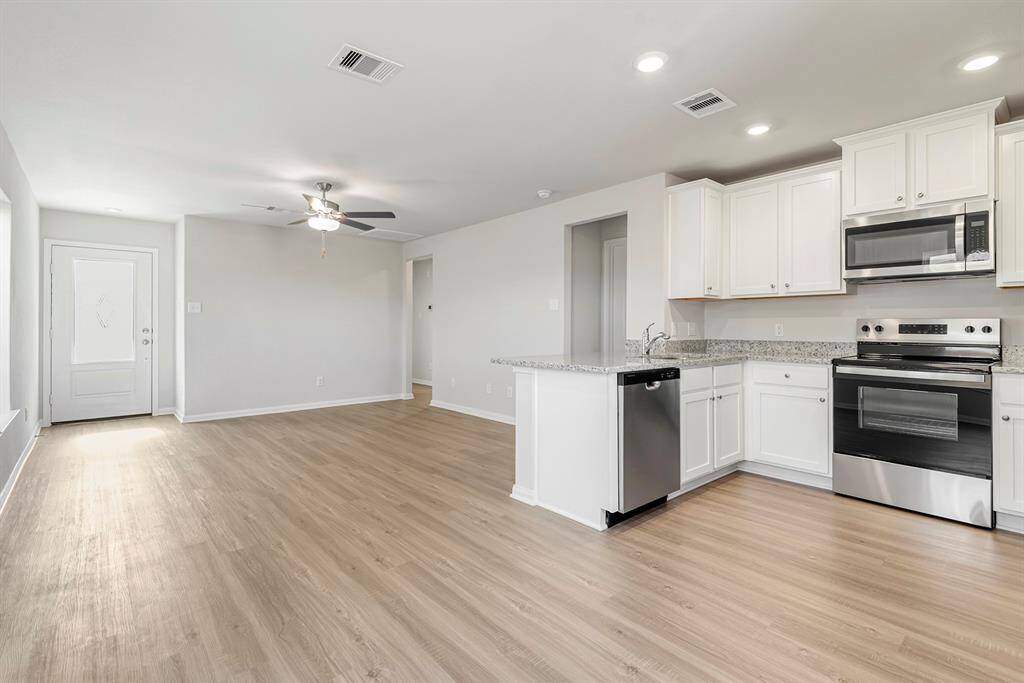 If you love an open concept kitchen and dining area for entertaining, you will love this home.