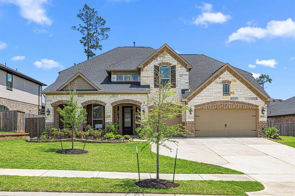 Welcome home! Beautiful curb appeal- brick & stone home, 3 car garage, well maintained landscaping and much more!
