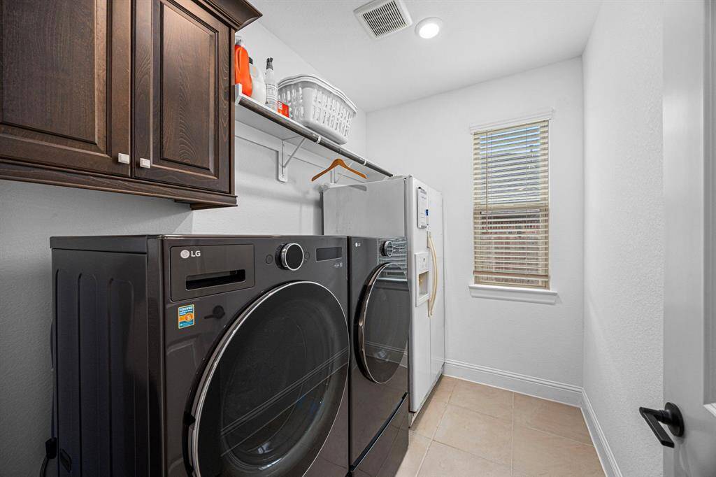 Laundry room with plenty of storage and space for refrigerator or deep freezer.