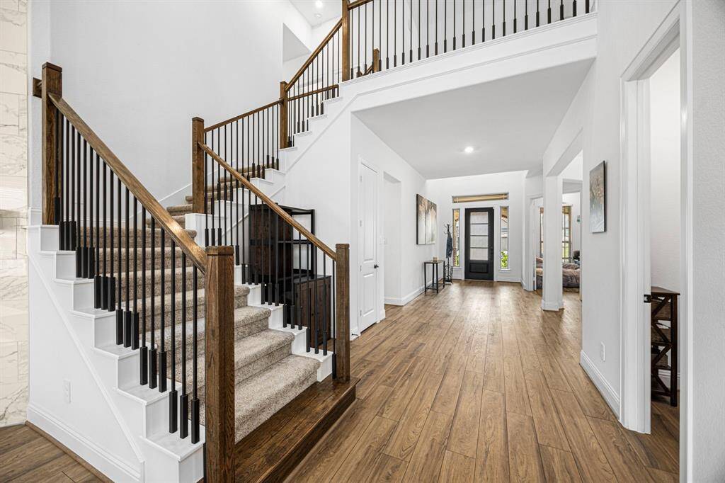 These beautiful stairs lead us to 3 bedrooms, 2 baths, game room and media room.