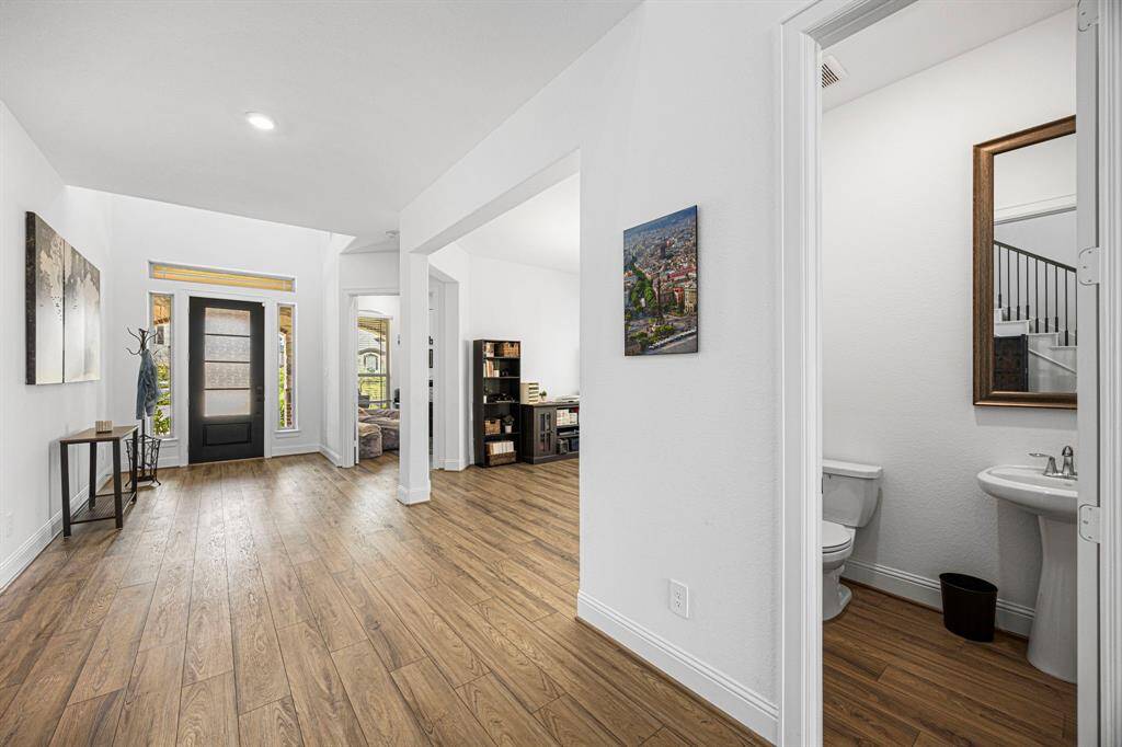 Across from the stairs sits the half bathroom.