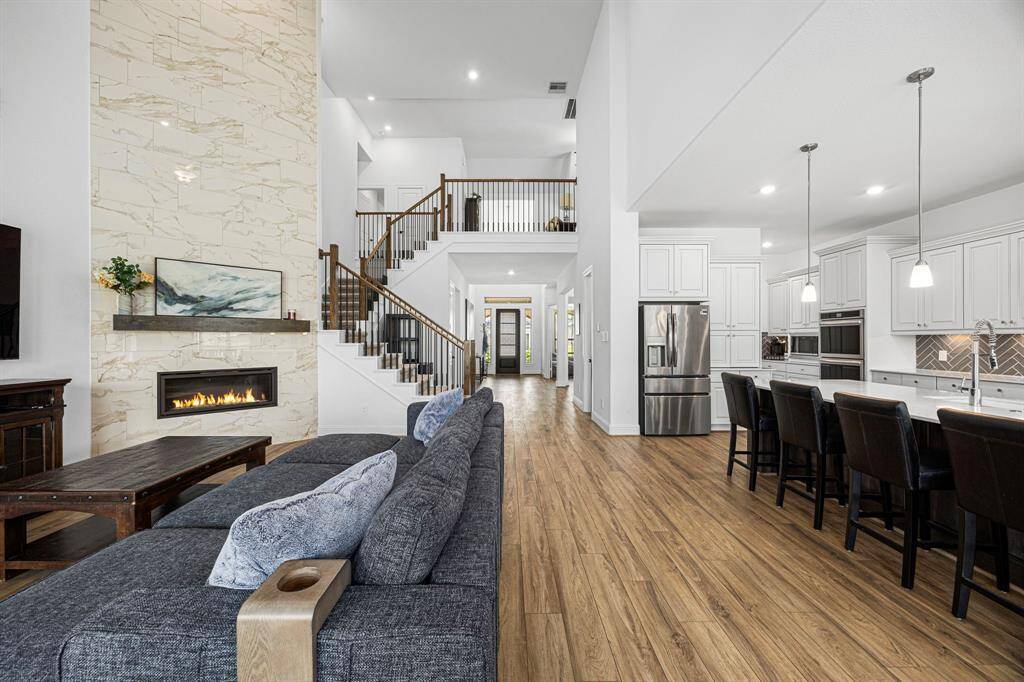 As you can see the living room is open to the kitchen, stairs and entryway.