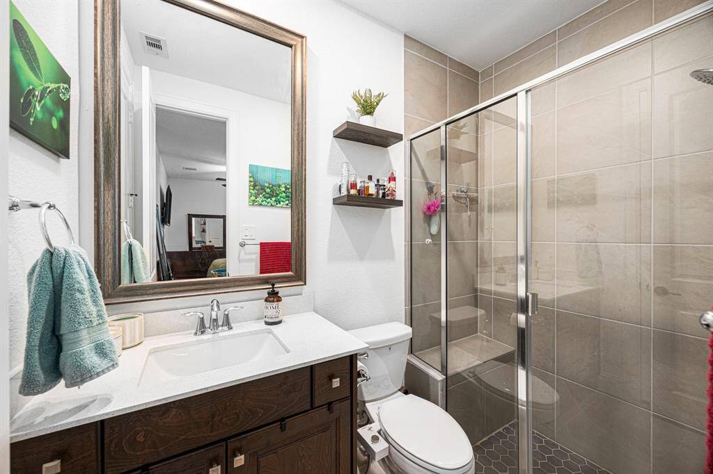 Ensuite bathroom with large walk-in shower and sit down bench.