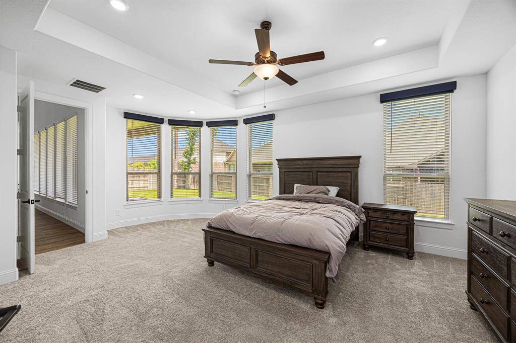 Primary bedroom located at the rear of the home for added privacy. Large double paned windows give so much natural light.