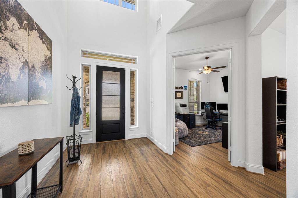 Soaring entryway ceiling to greet you home each day.