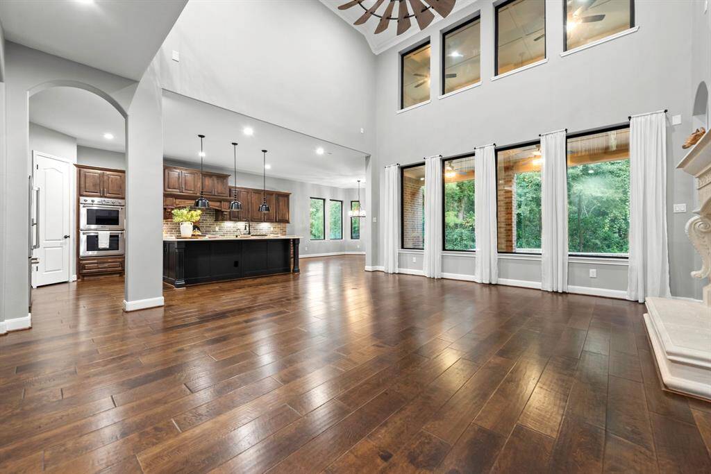 High ceiling living area open into gourmet kitchen.