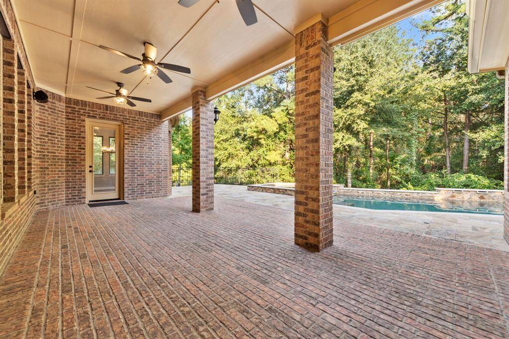 Brick covered back patio with summer kitchen plumb ready.