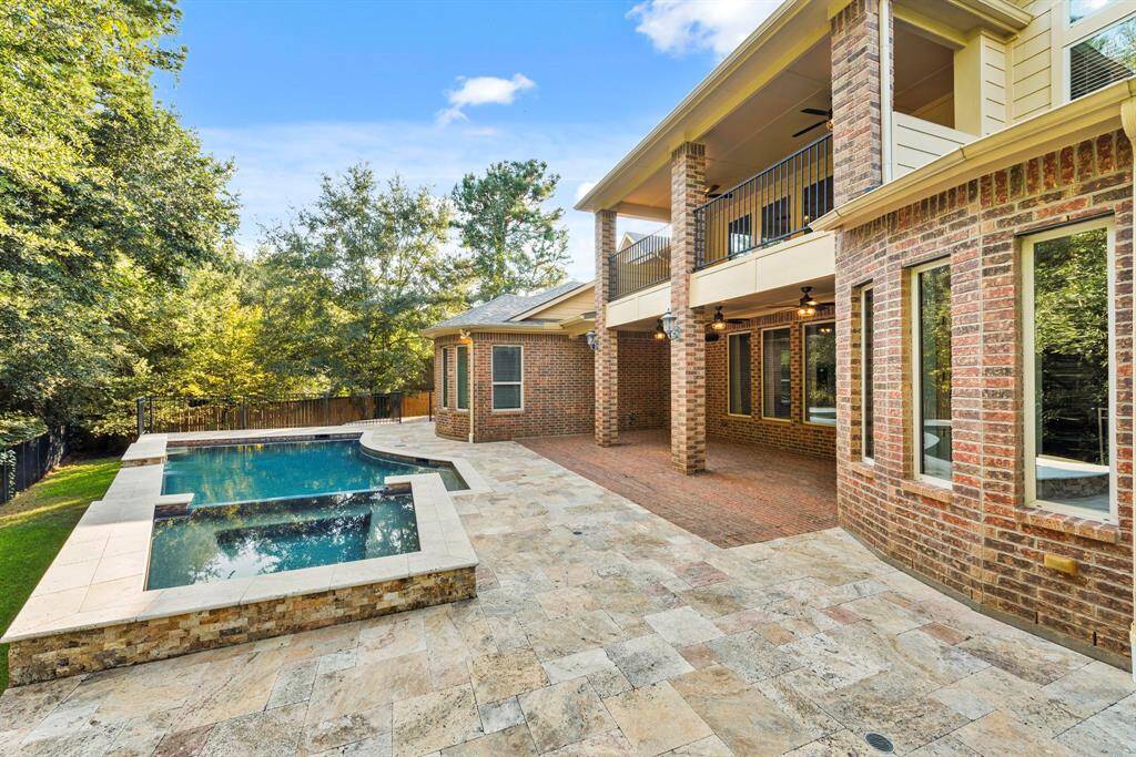 Heated pool and spa with expansive lounge space. 3 sheer decent waterfall features for a relaxing pool day!