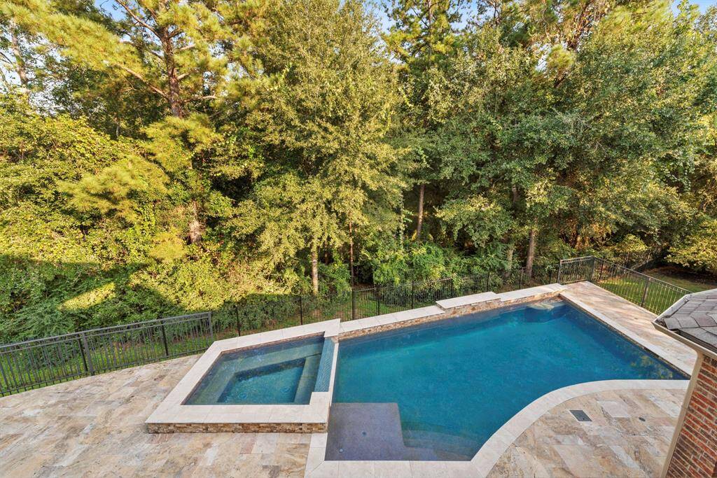Pool area is fully fenced off with wrought iron, 2 gated entrances leading off decking.