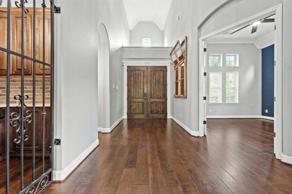 High ceiling entry with private study, wine room and downstairs secondary bedroom off the front.