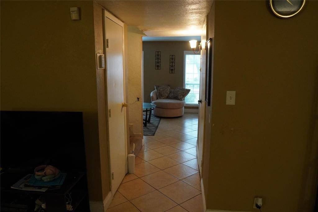 This hallway is looking from the den back into the formal living area.