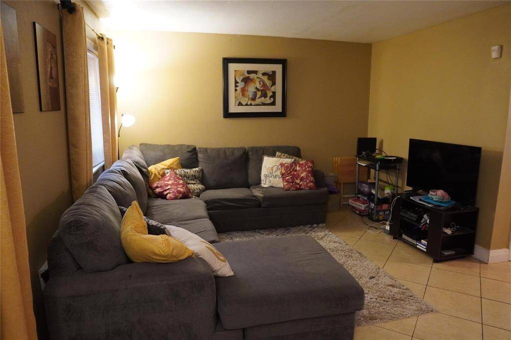 From the formal living area, enter into the very spacious den.