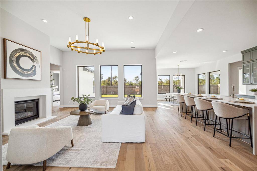 Fireplace in Living Area, view of Kitchen and informal Dining/Breakfast Area