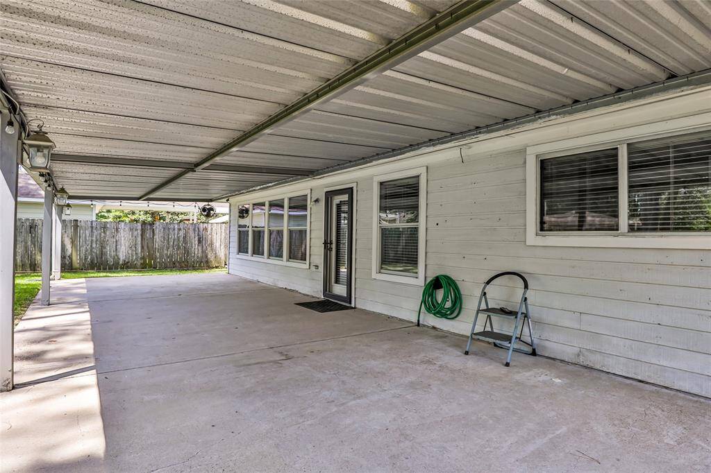 Plenty of lounging spaceon this covered back patio