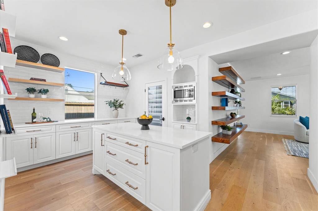 This kitchen was built for both beauty and function—with ample storage, a spacious island, and a walk-in pantry to keep everything in its place.