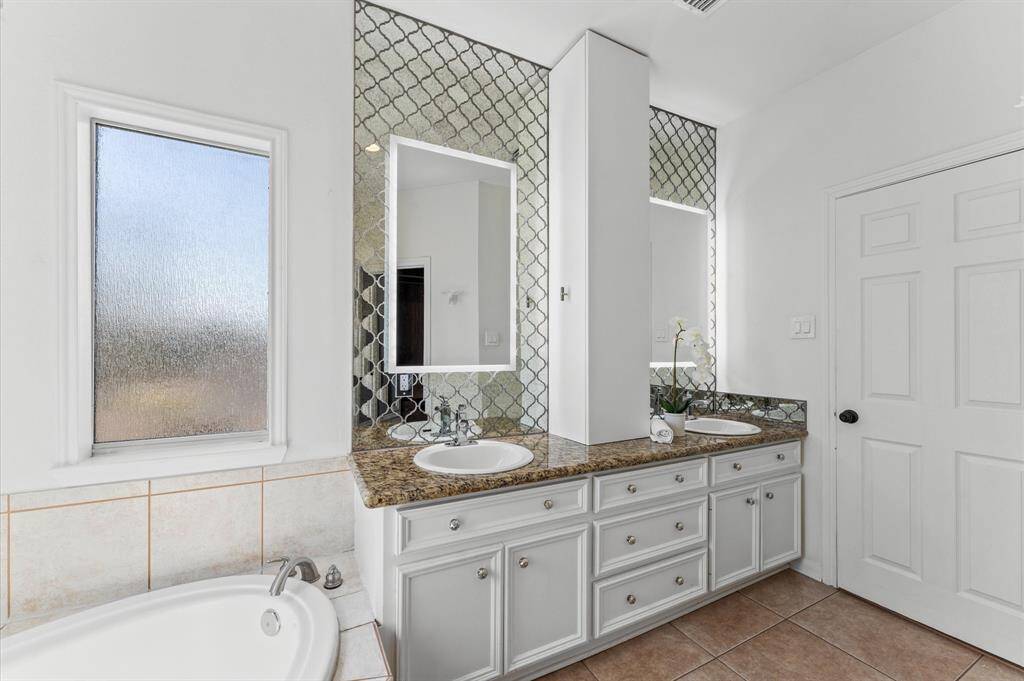 Luxury meets everyday function with dual vanities, LED backlit mirrors, and a smart storage tower for ultimate organization.