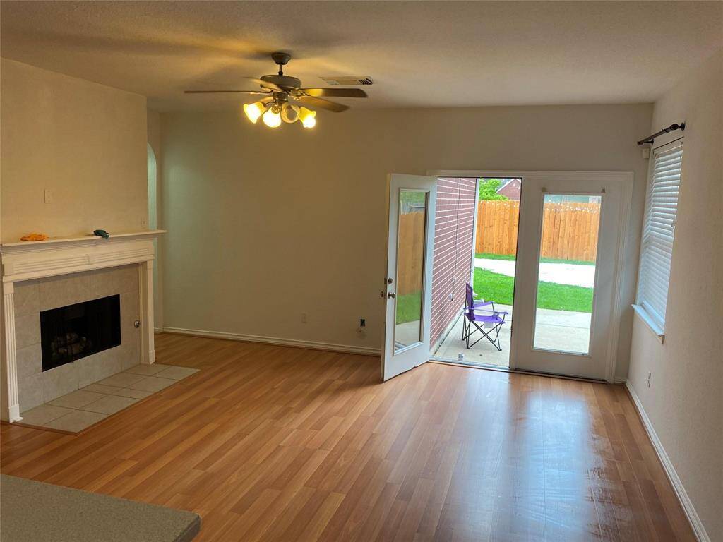 Double doors access to backyard patio.