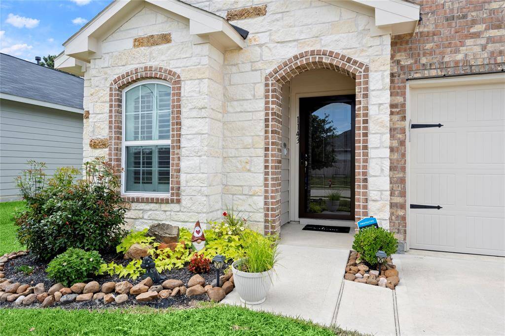 Stone entry with brick detailing.