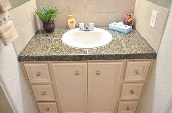 Laundry room with a washer and dryer located in the garage.