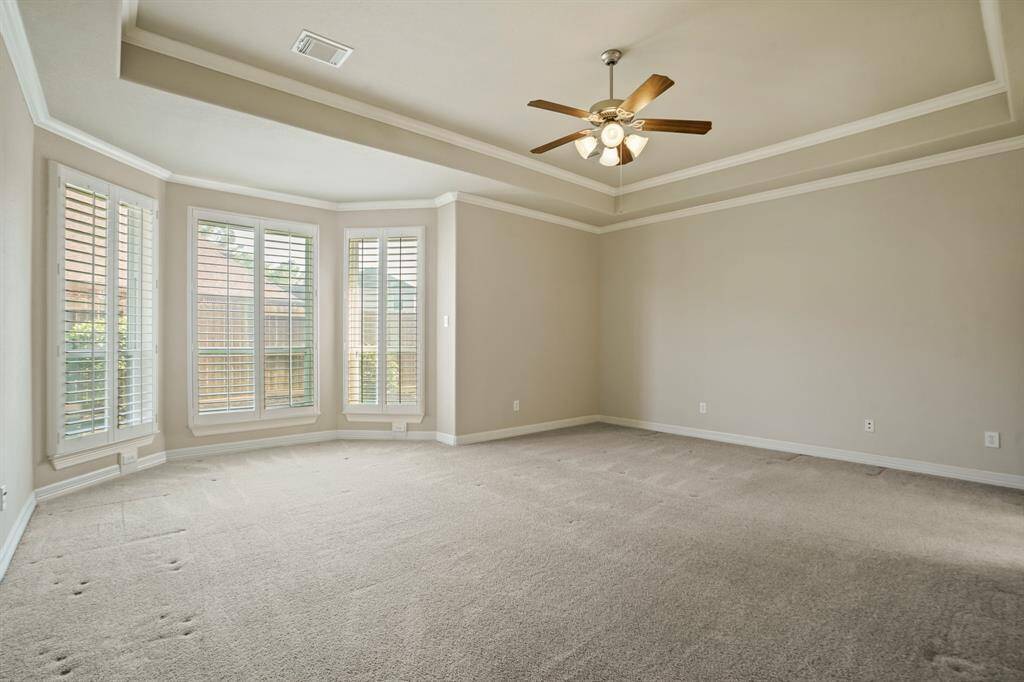 Primary bedroom is a haven with enclave for seating area.