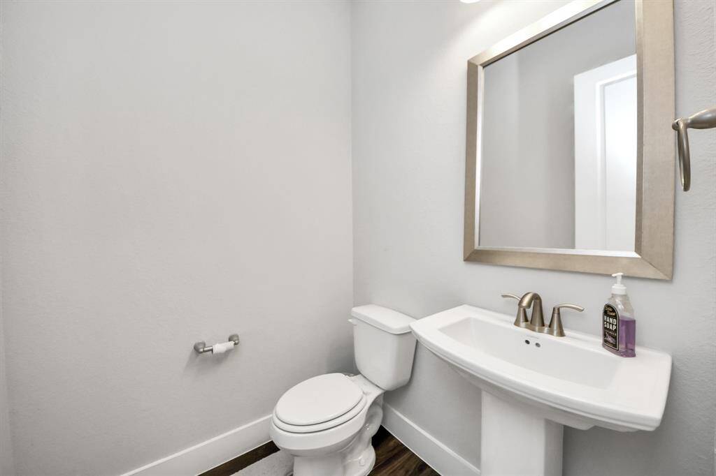 The easily accessible half bath is perfect for any guests needs