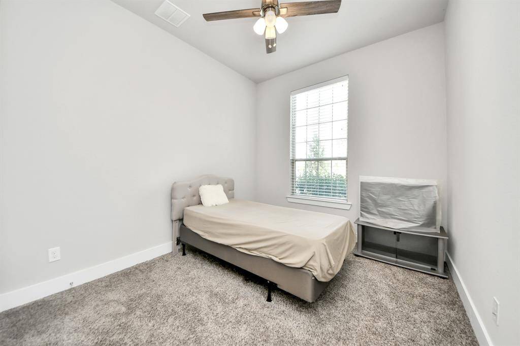 Secondary bedroom with large window bring life to the create an inviting living space!