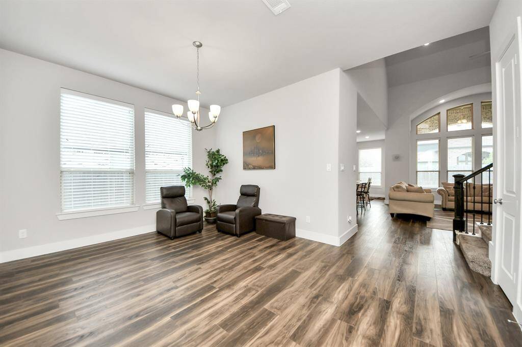 Formal dining area with beautiful light fixture