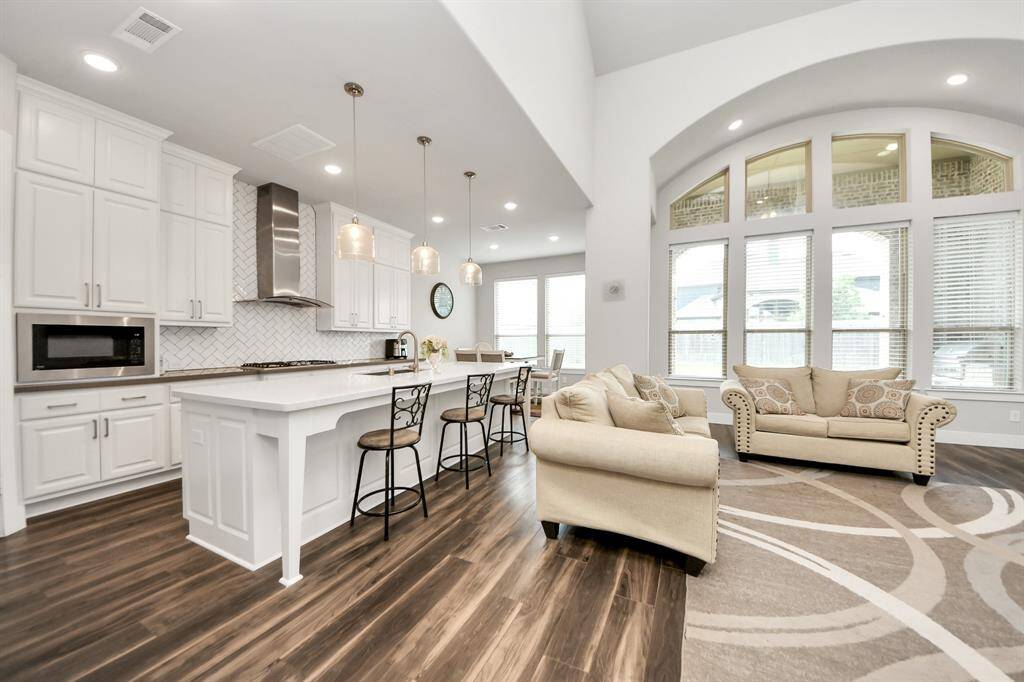 Entertaining is a breeze in this home's kitchen, as it overlooks the family room, allowing you to effortlessly participate in conversations and socializing
