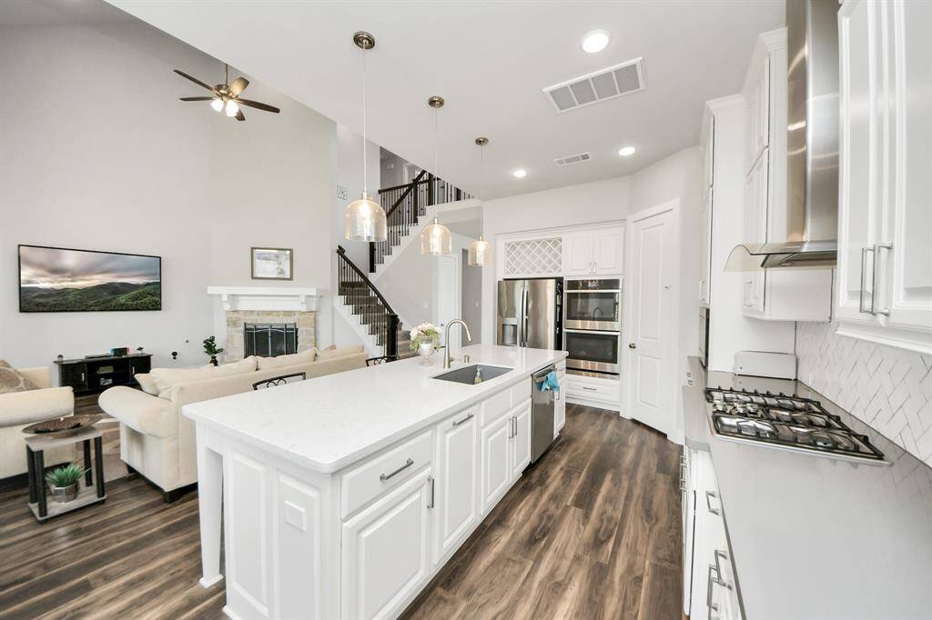 This kitchen boasts built-in stainless steel appliances, perfect for the home chef or entertainer