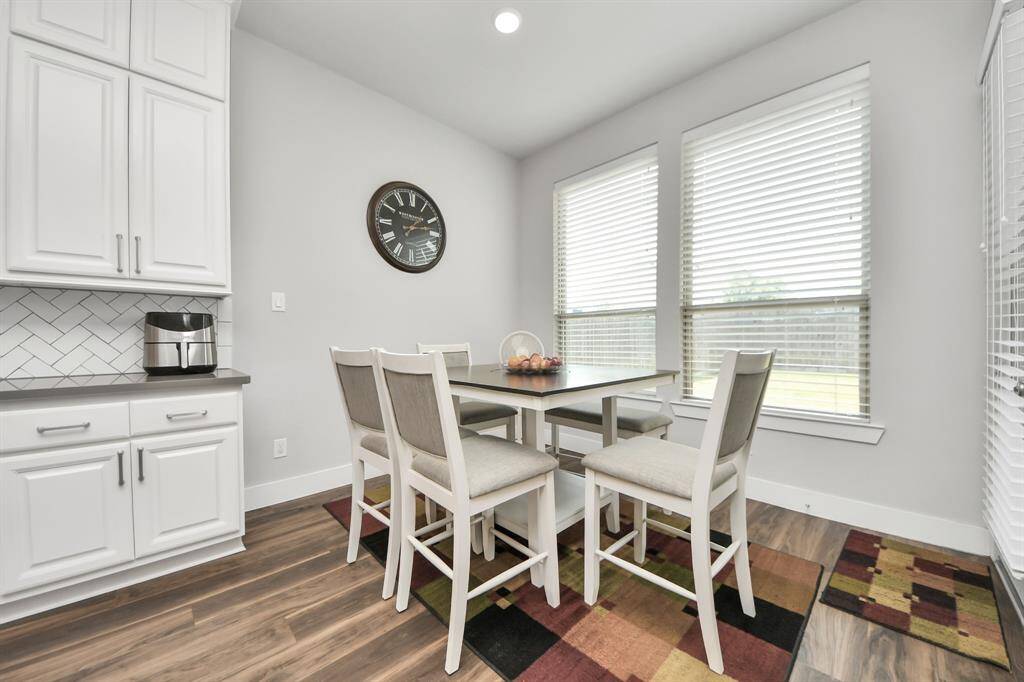 The breakfast area proximity to the kitchen allows for easy meal preparation and cleanup