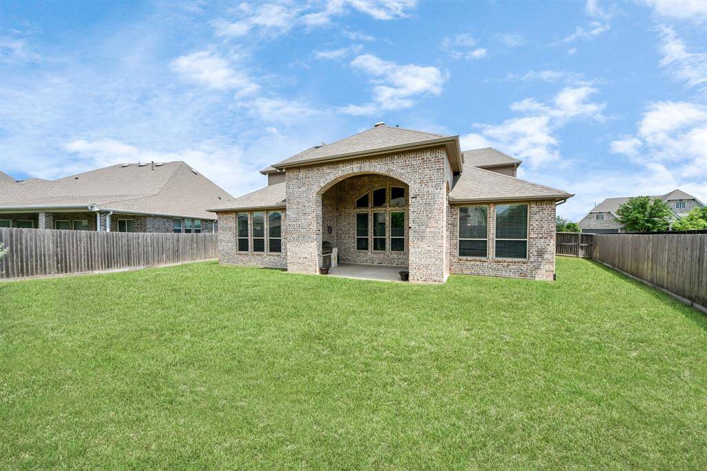 Additional view of your spacious backyard with its beautiful patio, perfect for your outdoor furniture and so much more
