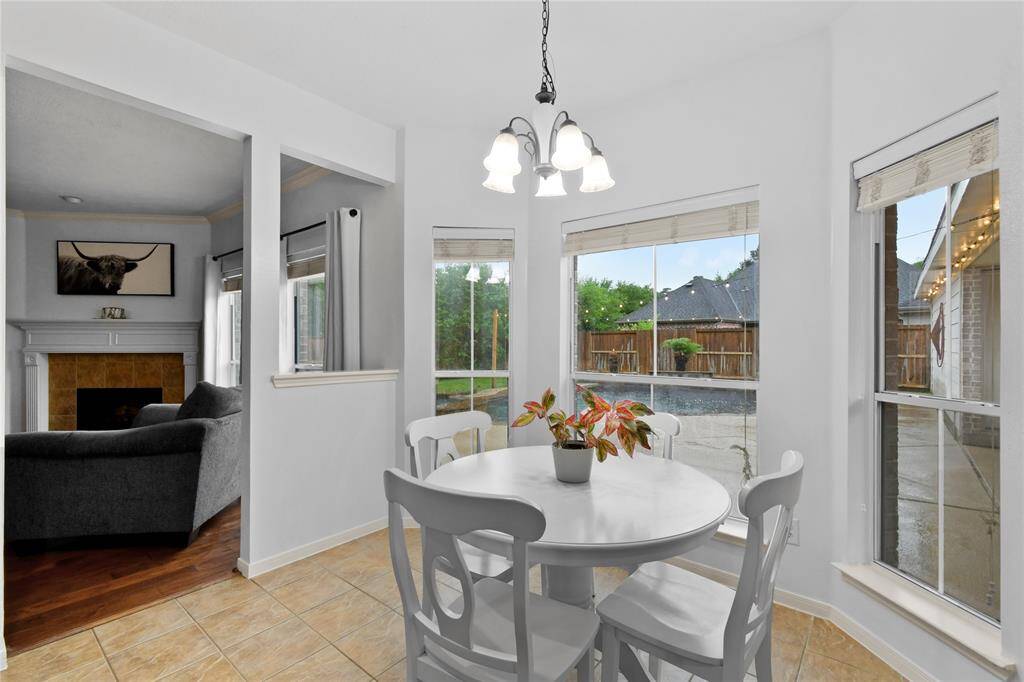 Sip your morning coffee while enjoying the tranquil views of your pool from the large bay windows.