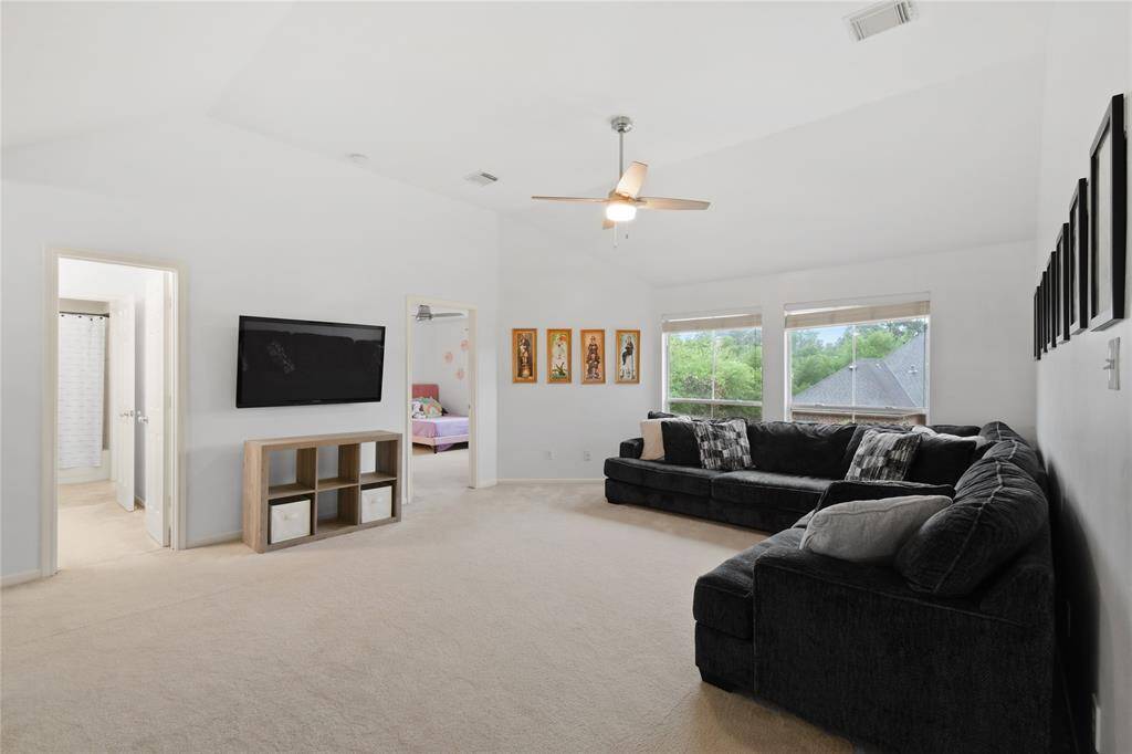 This is a wonderful oversized space with plenty of room for toys, a large couch, or pool table.