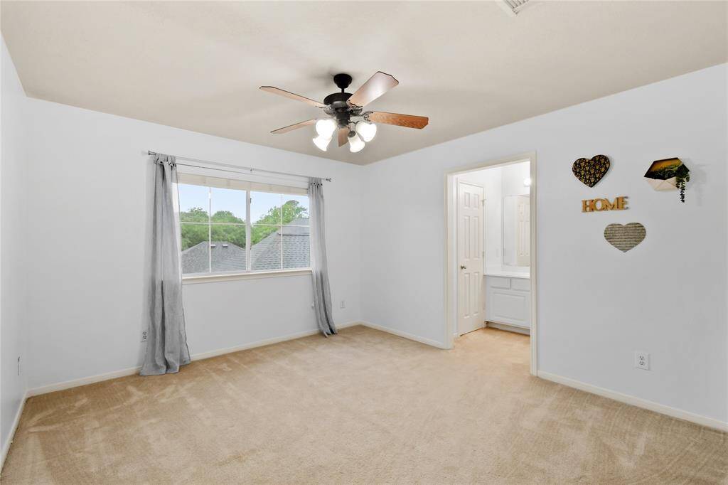 This secondary bedroom overlooks the pool, what a view!