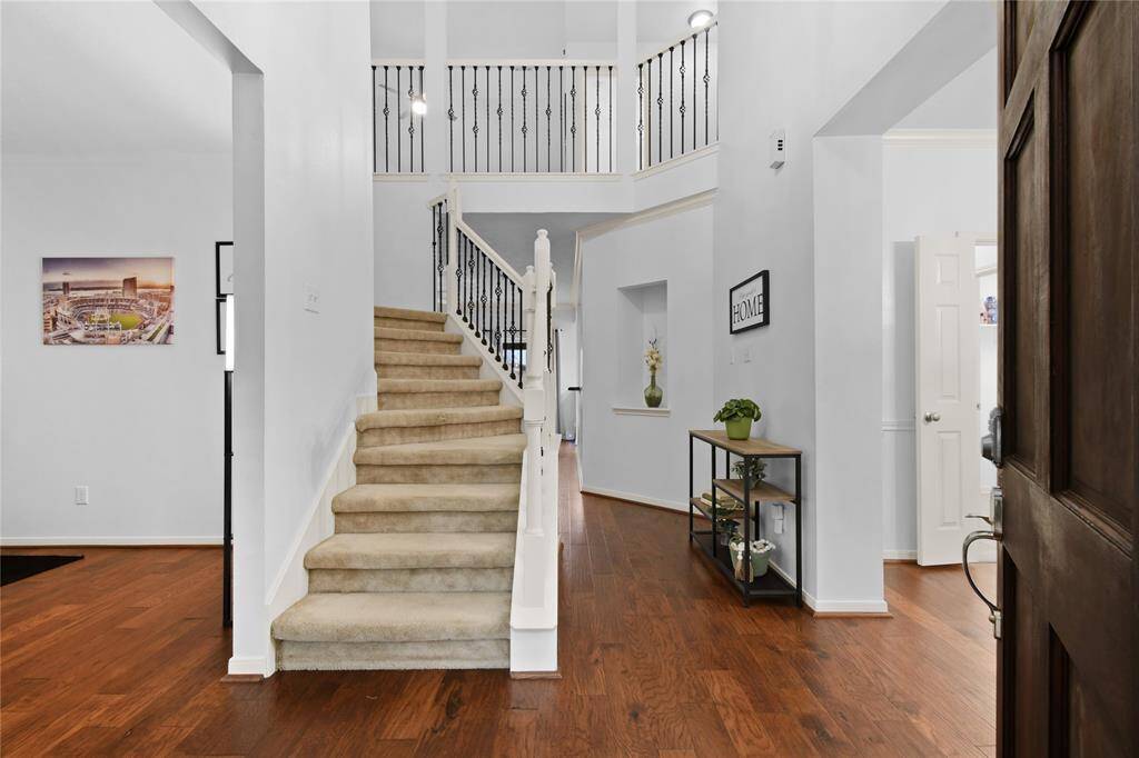 Step inside and appreciate the high ceilings, great natural light, and wood floors that run through the first floor living areas and owner's suite.