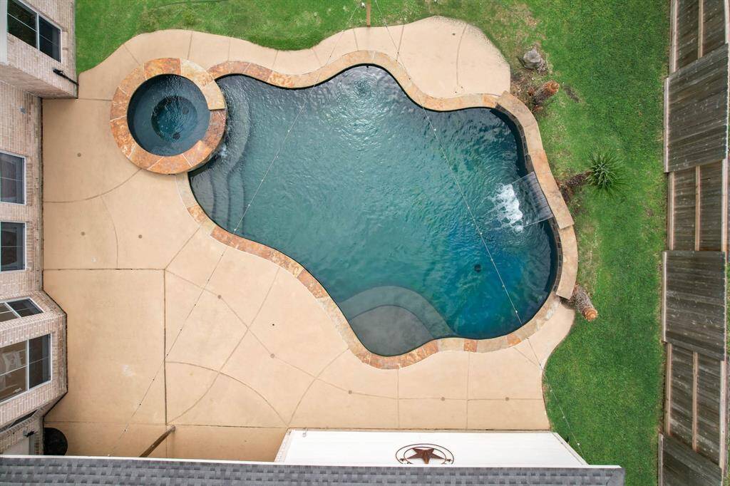 The large pool deck offers plenty of space for lounging by the pool.