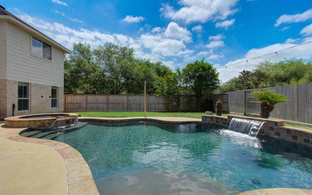 You'll love the extra privacy the corner lot gives you when enjoying the pool.