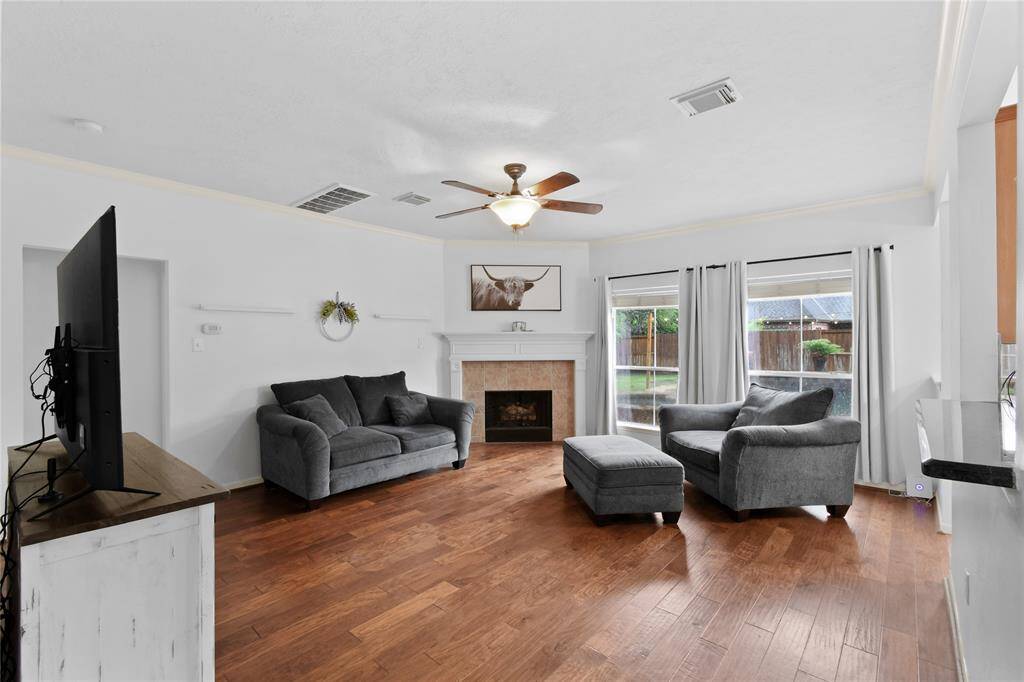 The family room is stunning with tranquil views of your backyard and a corner gas fireplace.