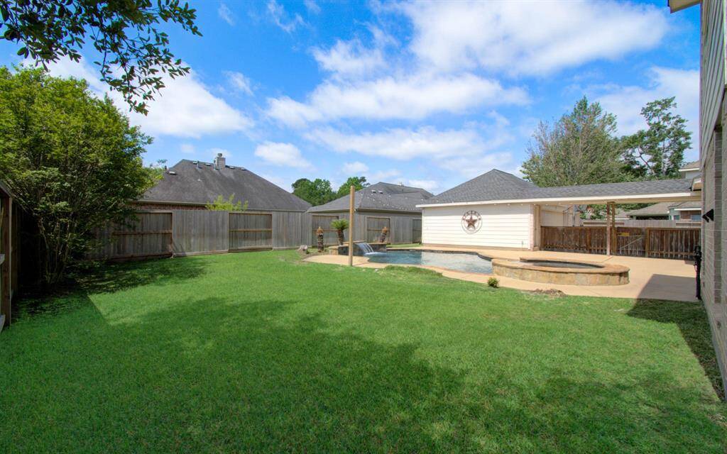 The backyard offers lots of room for the kiddos and pets to play.
