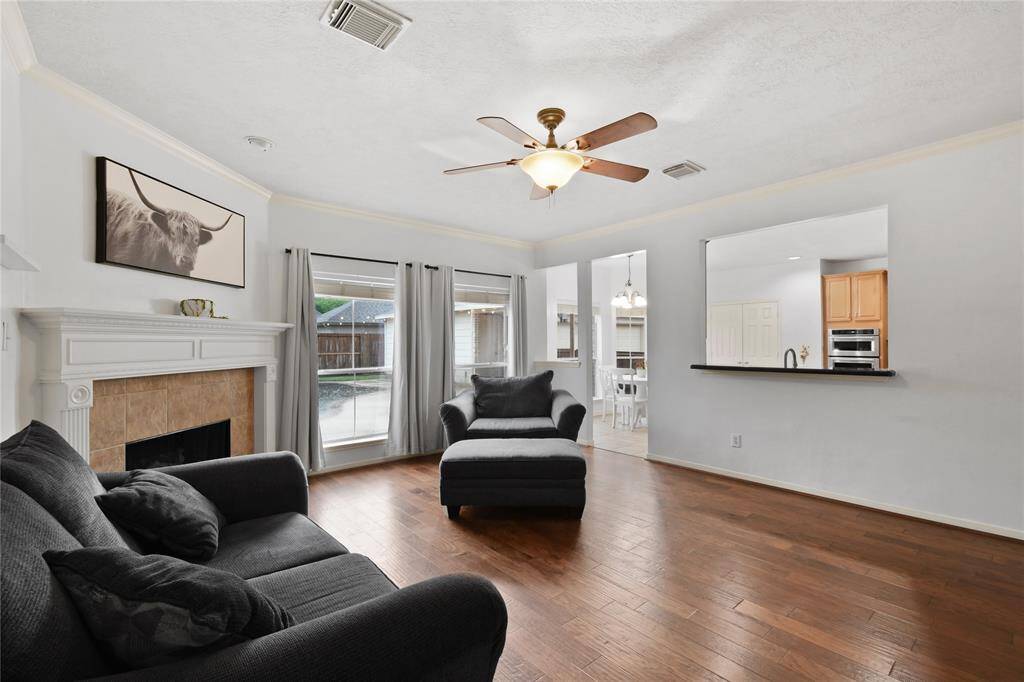 A serving and breakfast bar keeps the kitchen open to the family room.