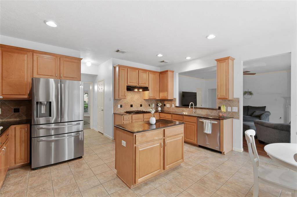 There is much to love about this kitchen including the gas range and single bowl sink.