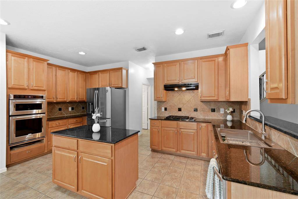 Abundant counter space and storage make this an easy kitchen to work in.