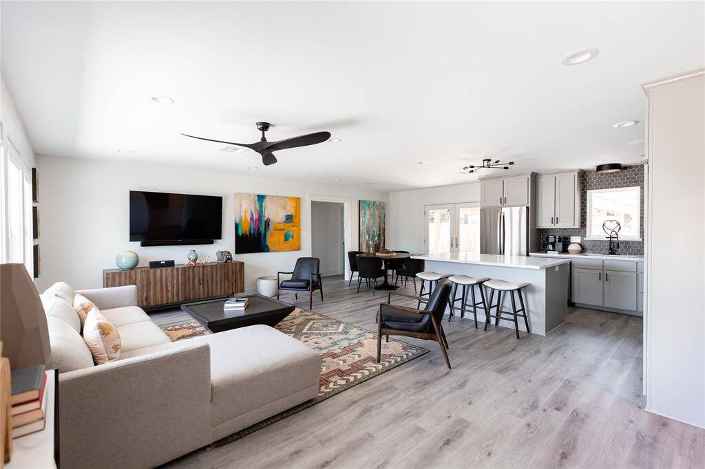 Spacious living space with beautiful wood flooring.